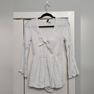 White romper with tie detail in the middle. Italian summer vibes